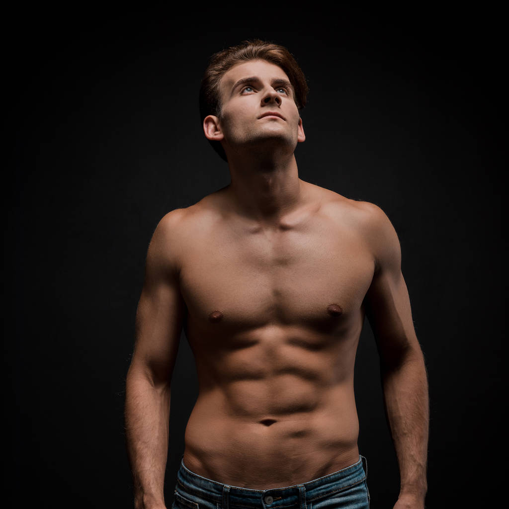 handsome sexy man posing isolated on black - Photo, Image