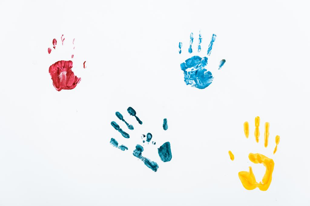 yellow, blue and red hand prints on white  - Photo, Image