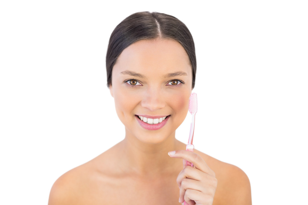 Smiling woman holding her teeth brush - Photo, Image