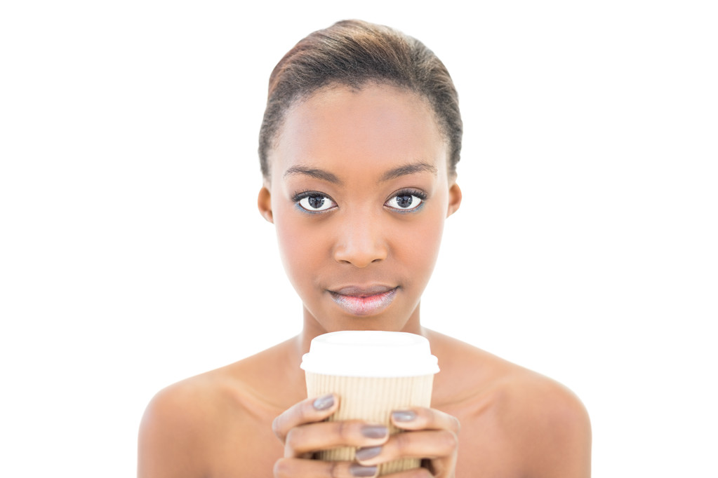 Serious natural beauty holding coffee cup - Photo, Image