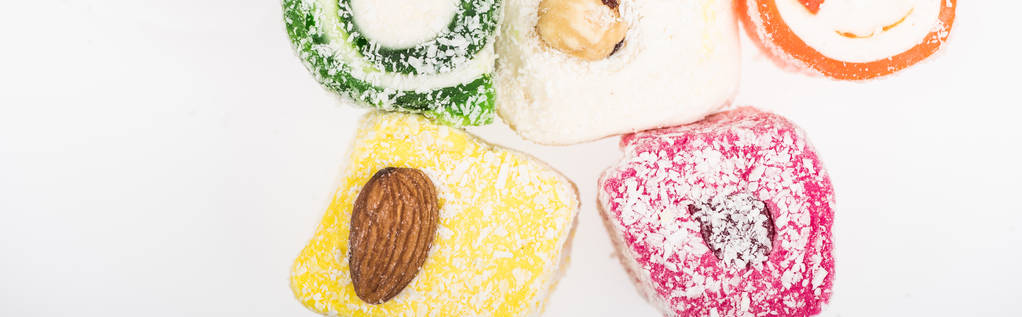 top view of assorted delicious turkish delight in coconut flakes isolated on white, panoramic shot - Photo, Image