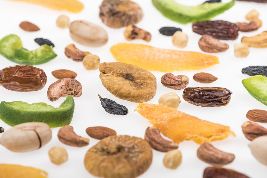 close up view of assorted nuts, dried fruits and candied fruit isolated on white - Photo, Image