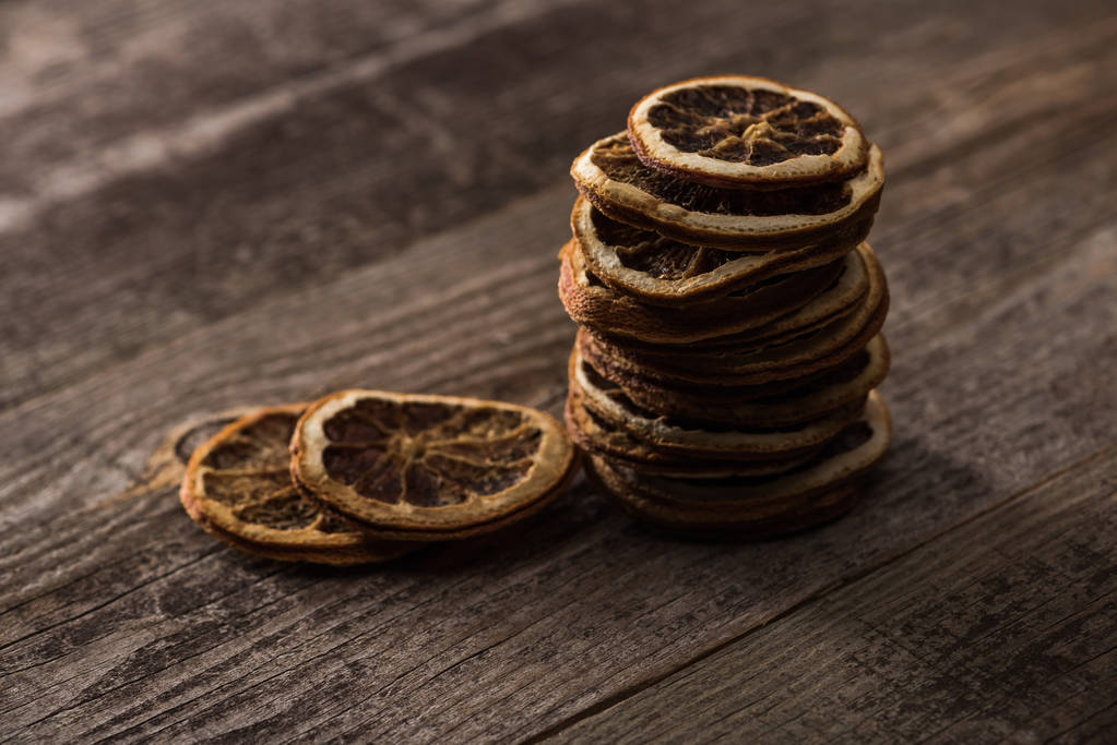 dried citrus slices on wooden brown surface - Photo, Image