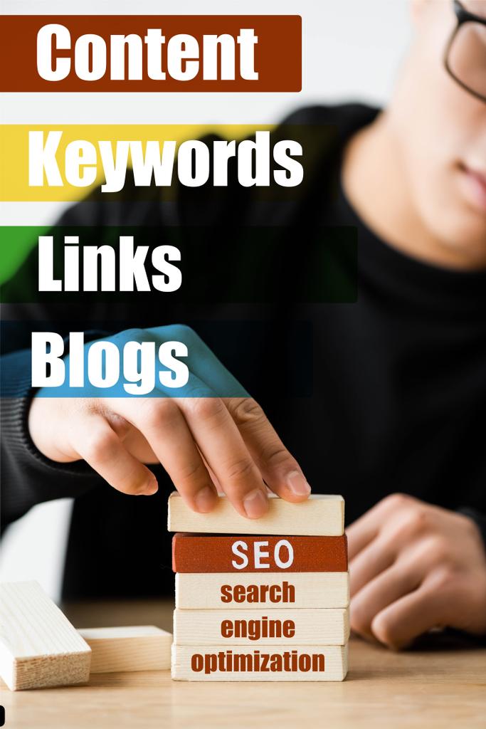 selective focus of seo manager stacking wooden rectangles with lettering near illustration with keywords, links, blogs words - Photo, Image