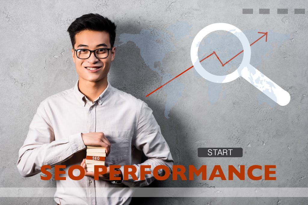 smiling asian seo manager holding rectangle with seo lettering and standing near seo performance illustration - Photo, Image