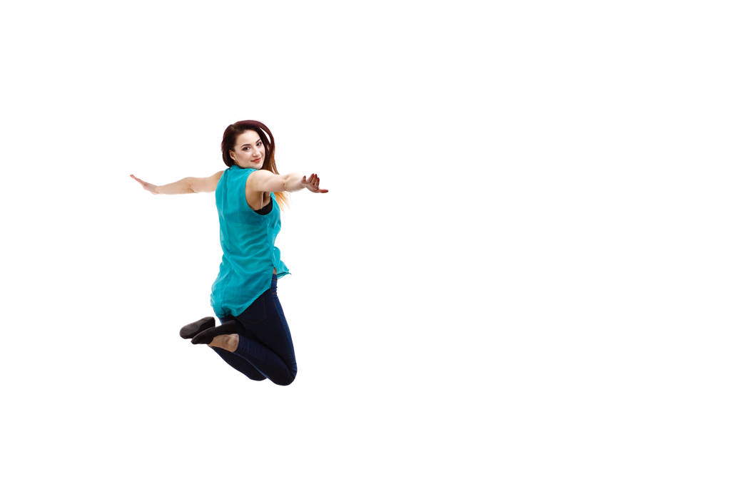 Jovem mulher pulando no fundo branco  - Foto, Imagem