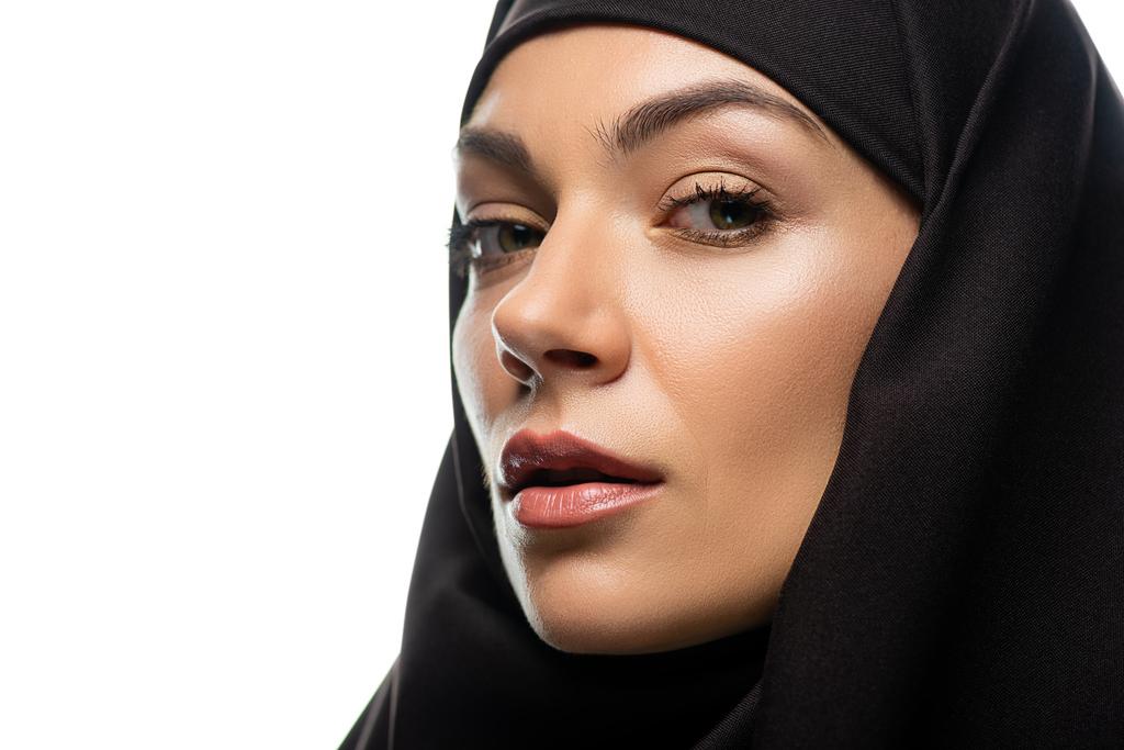 attractive young Muslim woman in hijab looking at camera isolated on white - Photo, Image