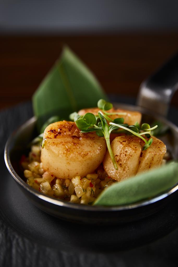 close up view of delicious grilled scallops with green leaves and microgreens - Photo, Image