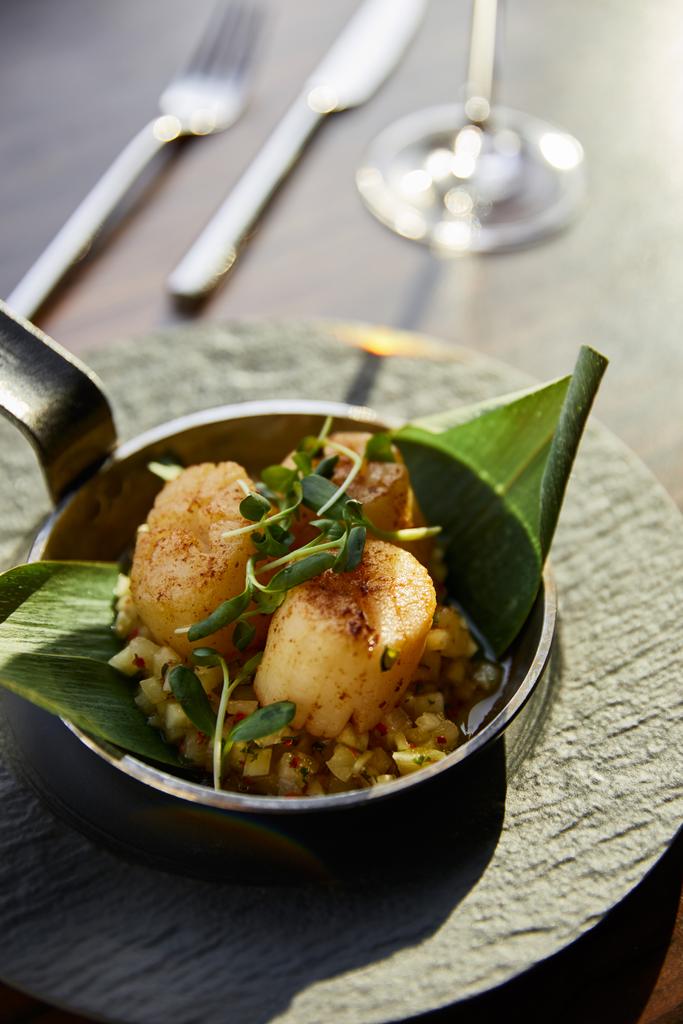 delicious grilled scallops served in pan with microgreens in sunlight - Photo, Image