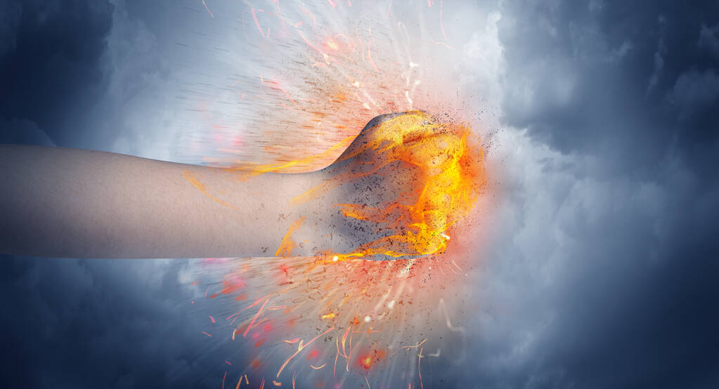 Hand hits intense and makes fire - Photo, Image