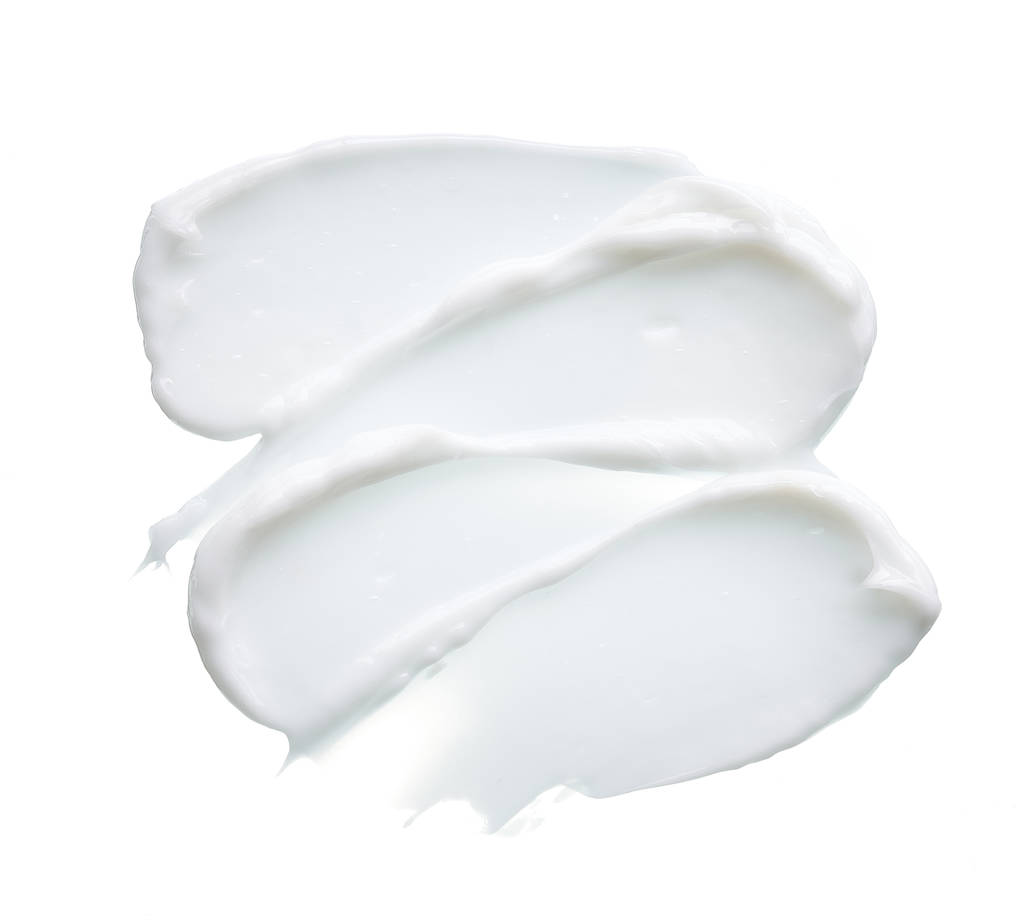 weiße Textur und Abstrich von Gesichtscreme oder weißer Acrylfarbe isoliert auf weißem Hintergrund - Foto, Bild