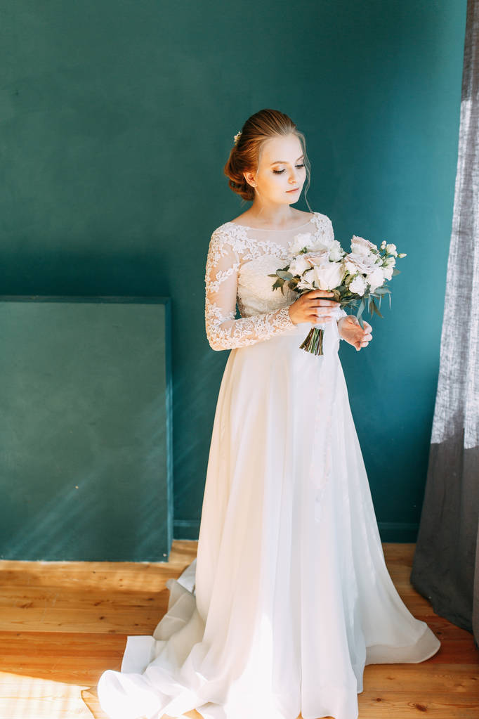 European-style wedding at the hotel. Bride in a white dress in the interior Studio.  - Photo, Image