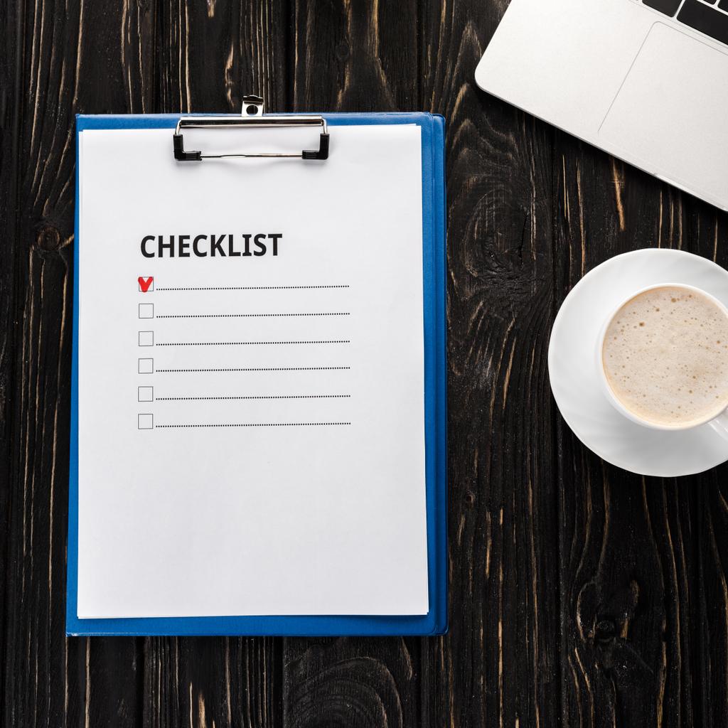 top view of clipboard with checklist near laptop and cup of coffee on table, e-commerce concept - Photo, Image