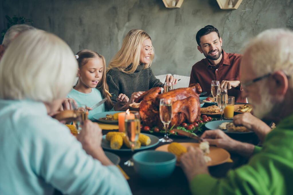 Big family happy celebrate thanksgiving day gather mature generation small little kids sit table eat evening feast dinner corns vegetables wine chicken harvest have feasting in house indoors - Photo, Image