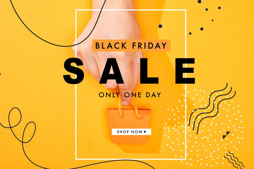 обрезанный вид руки с небольшой сумкой для покупок на ярко-оранжевом фоне с черной иллюстрацией продажи в пятницу
 - Фото, изображение