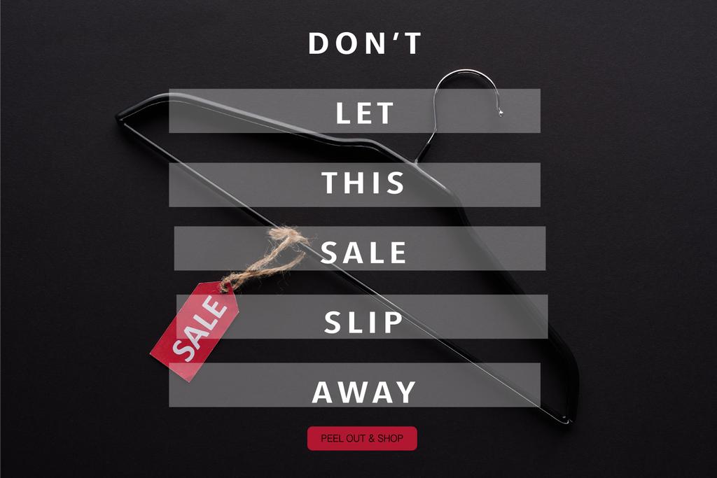 top view of hanger with sale label on black background with dont let this sale slip away illustration - Photo, Image