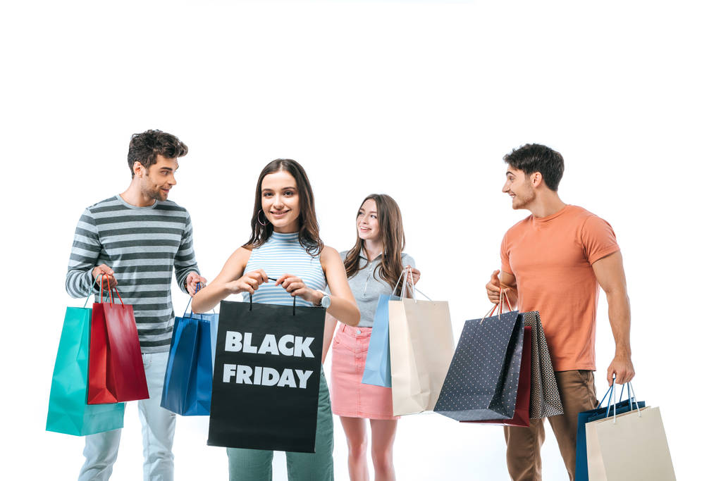 friends holding shopping bags on black friday, isolated on white - Photo, Image