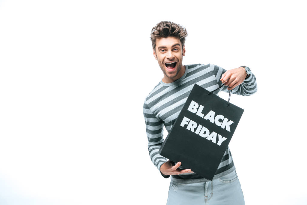 emotional man holding shopping bag on black friday, isolated on white - Photo, Image