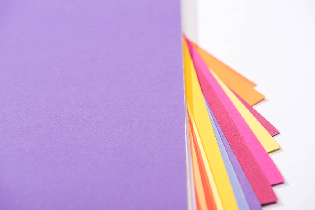 high angle view of  bright and colorful papers on white background  - 写真・画像