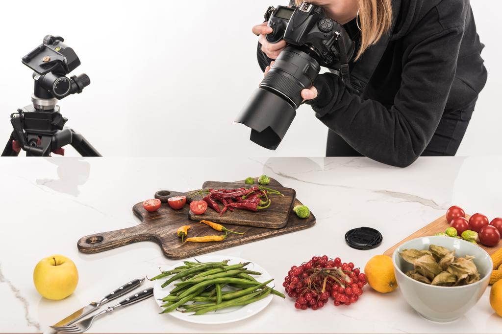 female photographer making food composition for commercial photography and taking photo on digital camera  - Photo, Image