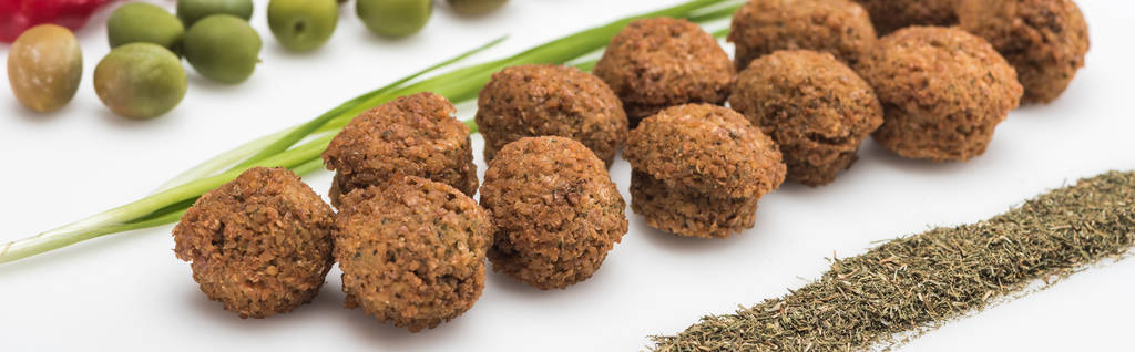 close up view of olives, green onion and falafel on white background, panoramic shot - Photo, Image