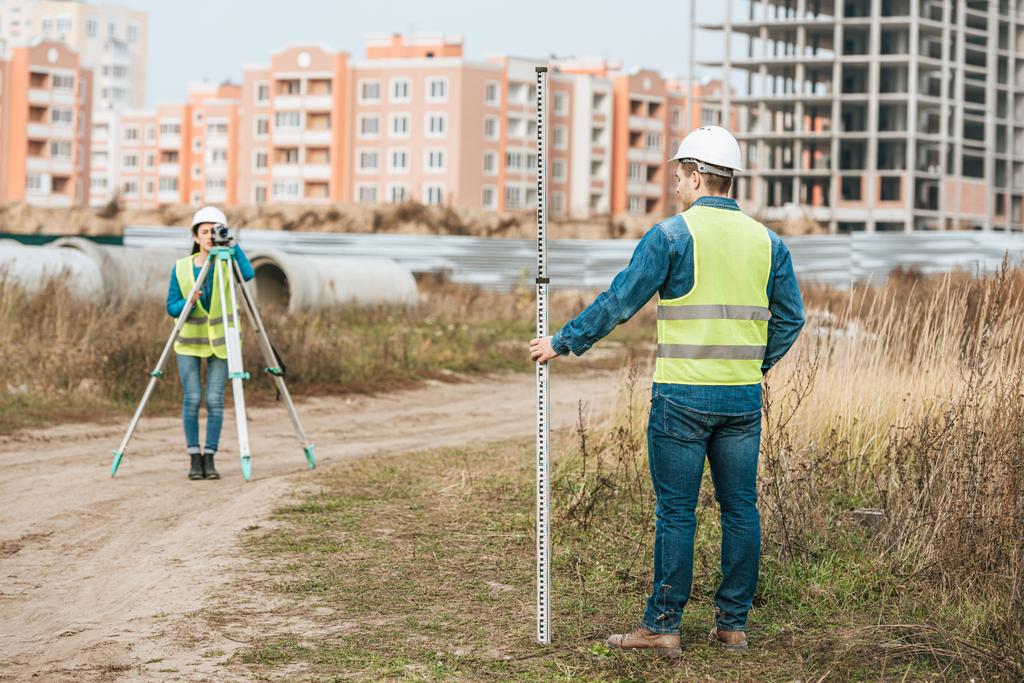 Surveyors measuring land with digital level and ruler - Photo, Image