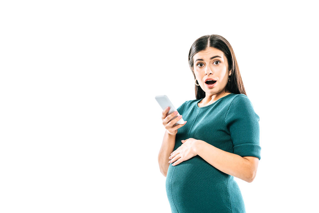 choqué fille enceinte en utilisant smartphone isolé sur blanc
 - Photo, image