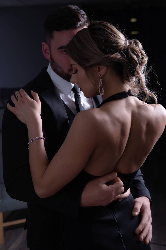 The man unbuttons the dress modestly embracing his girl - Photo, Image