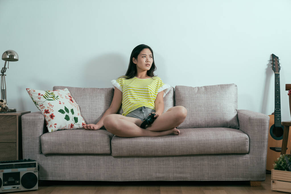 unhappy young woman playing video games - Photo, Image