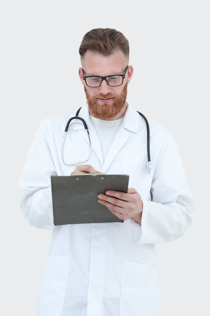Лікар пише медичний звіт. ізольовані на білому
 - Фото, зображення