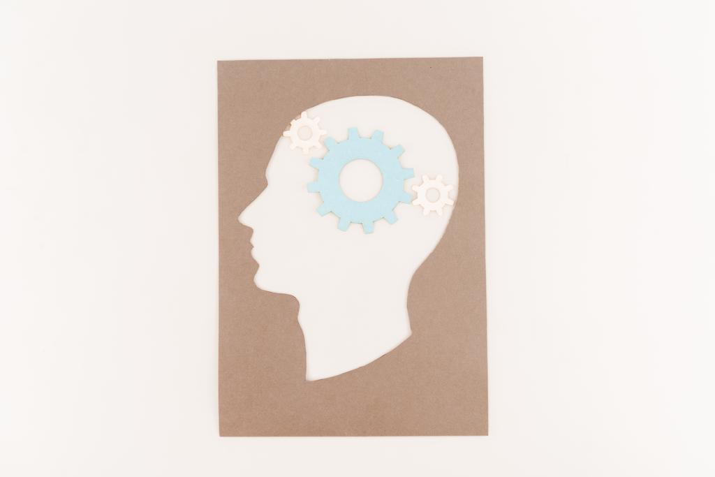 vrchní pohled na siluetu lidské hlavy s modrým ozubením izolovaným na bílém - Fotografie, Obrázek