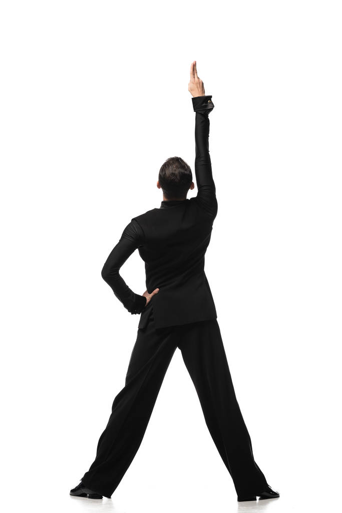 白い背景に手でタンゴを演奏エレガントな黒のスーツのダンサーのバックビュー - 写真・画像