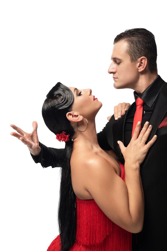passionate dancers looking at each other while performing tango isolated on white - Photo, Image