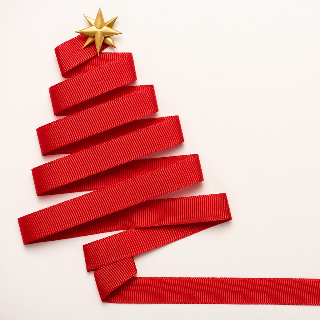 top view of red decorative ribbon with star shape bow isolated on white  - Photo, Image