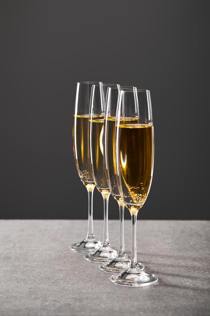 sparkling wine in glasses for celebrating christmas eve on grey - Photo, Image