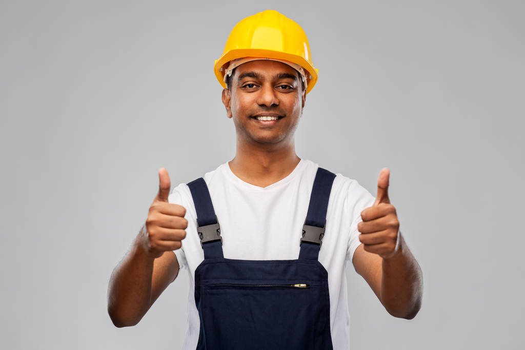 felice lavoratore indiano o costruttore mostrando pollici in su
 - Foto, immagini