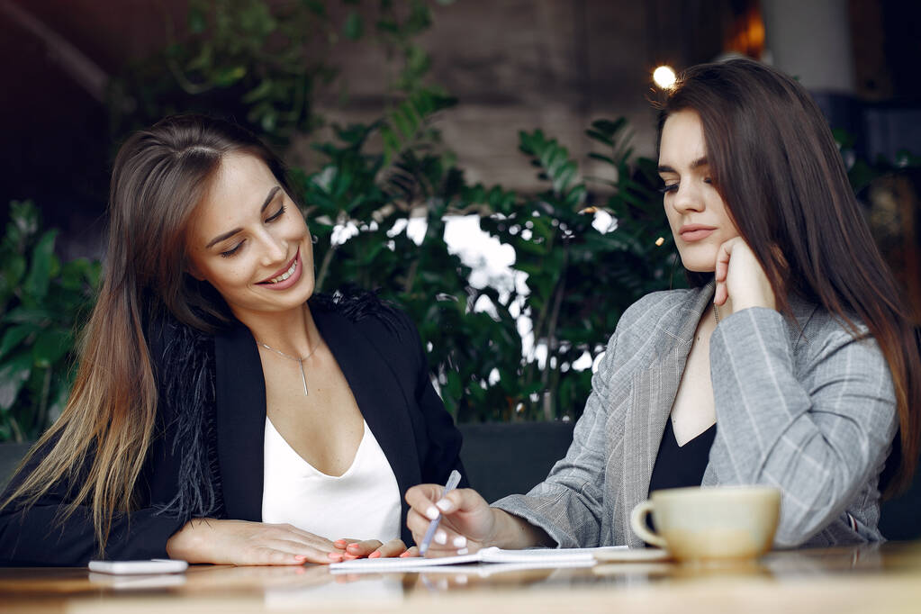 Two businesswomen working in a cafe - Photo, Image