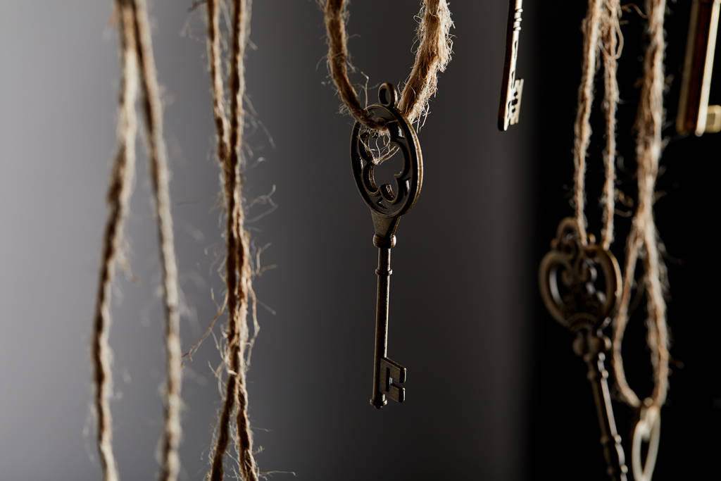 close up view of vintage keys hanging on ropes - Photo, Image