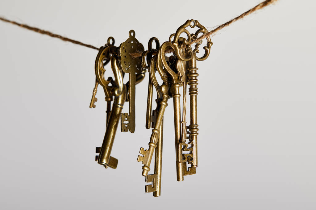 vintage keys hanging on rope isolated on white - Photo, Image