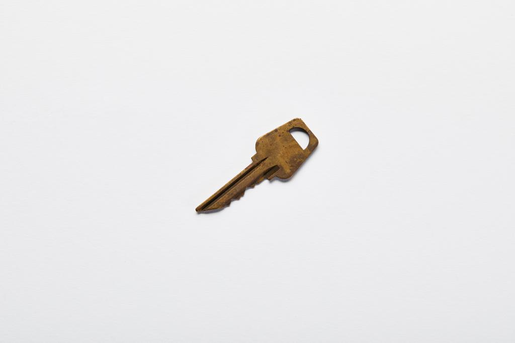 top view of vintage rusty key on white background - Photo, Image