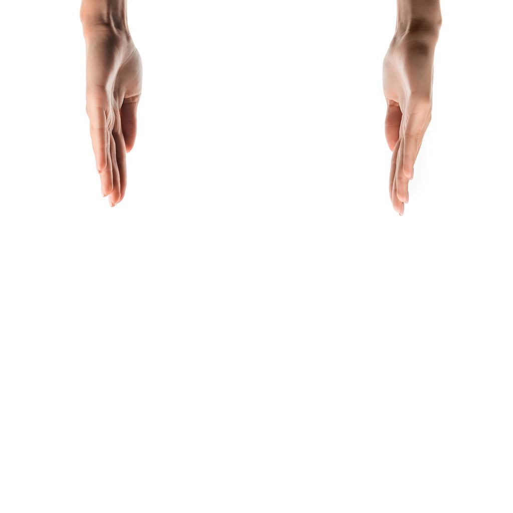 vista cortada da mulher com as mãos levantando isolado no branco
  - Foto, Imagem