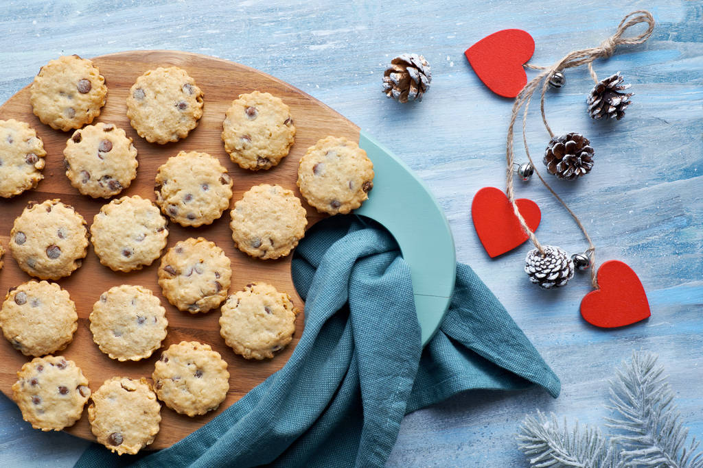 Christmas chocolate chip cookies, flat lay with winter decorations - 写真・画像