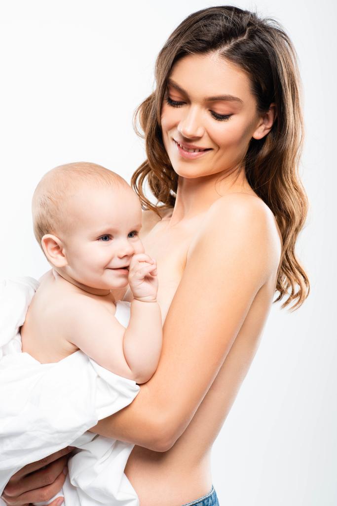 portrait of cheerful naked mother holding baby, isolated on white - Photo, Image