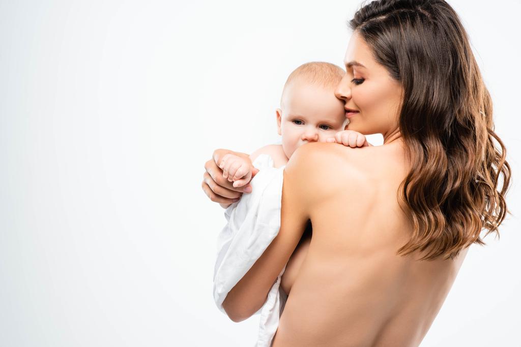 portrait of attractive naked mother holding baby, isolated on white - Photo, Image
