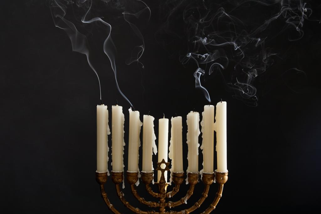 candles with smoke in menorah on Hanukkah on black - Photo, Image