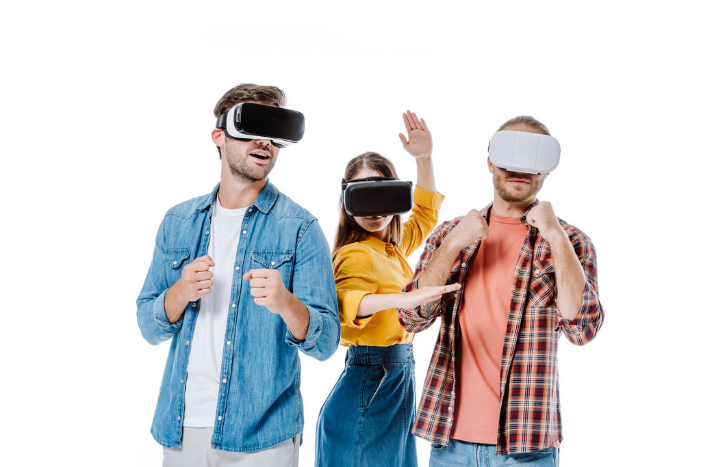 three young friends in vr headsets imitating fight isolated on white - Photo, Image