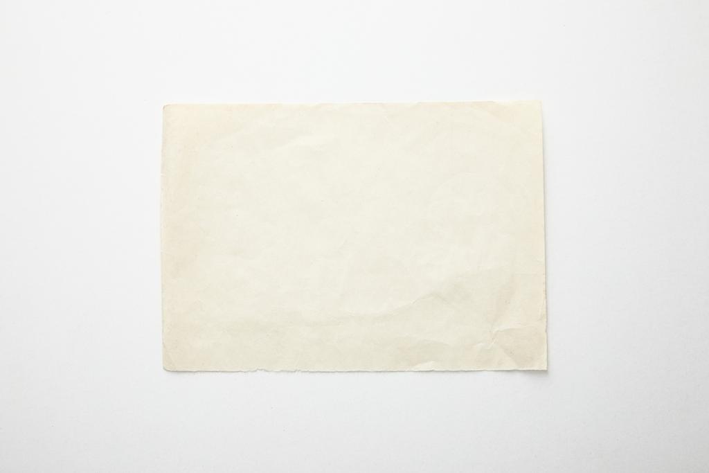 vista superior de papel vintage vacío sobre fondo blanco
 - Foto, imagen