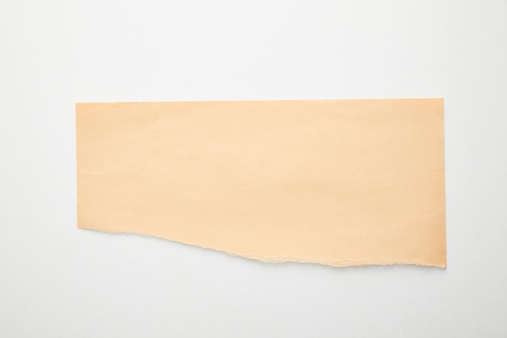 felső nézet üres narancssárga papír fehér háttér - Fotó, kép