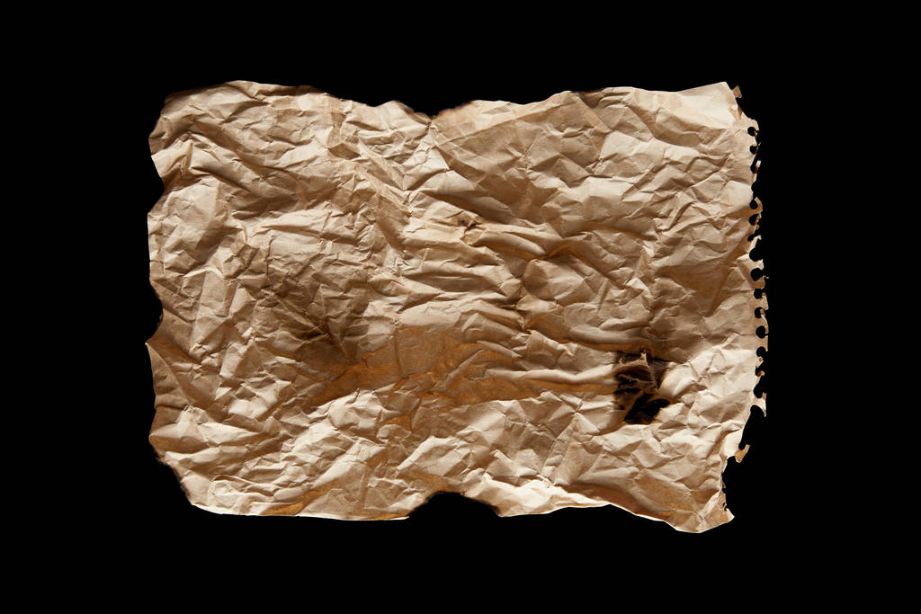 top view of empty crumpled and burnt vintage paper isolated on black - Photo, Image