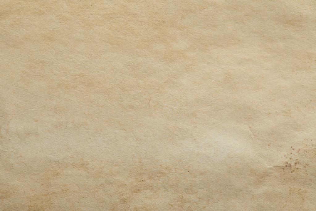 bovenaanzicht van vintage beige papieren textuur met kopieerruimte - Foto, afbeelding